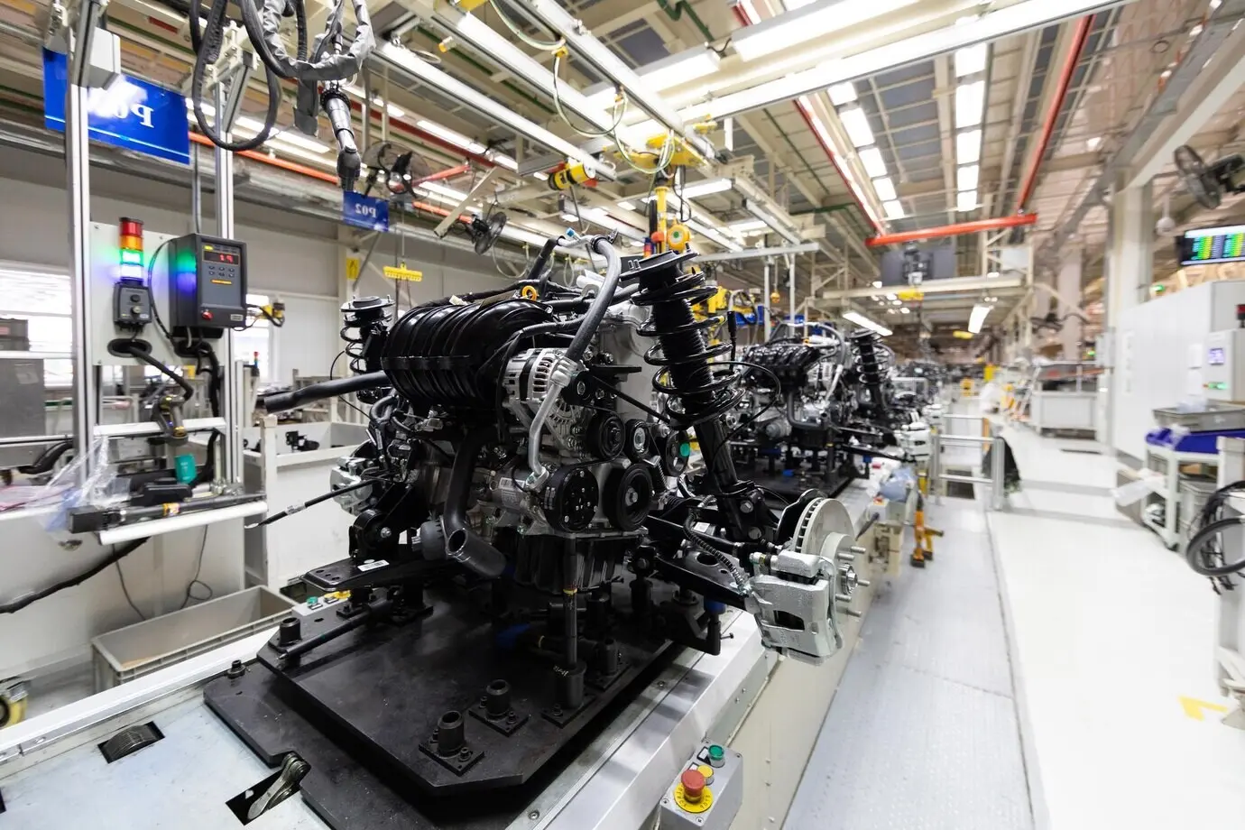 Robotic equipment assembles a motor vehicle—a modern car—at the factory.